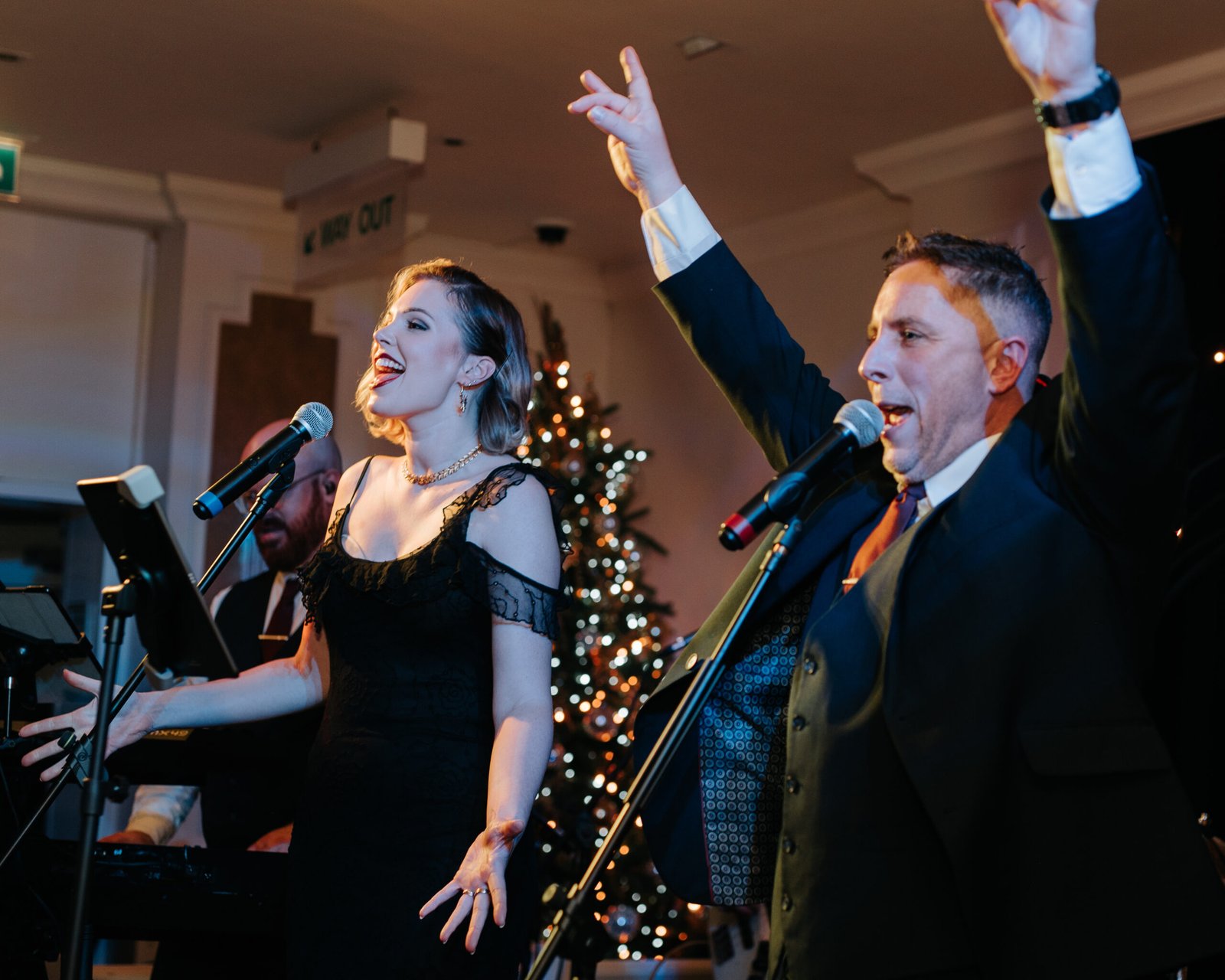 Excited crowd dancing to Surge Party Band