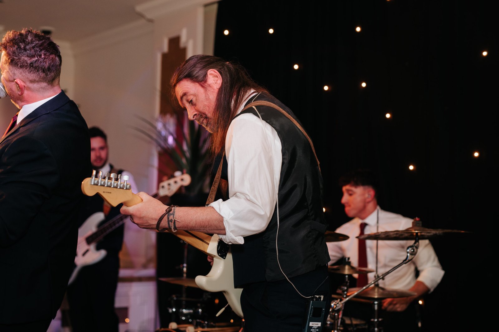 Lead singers of Surge Party Band on stage