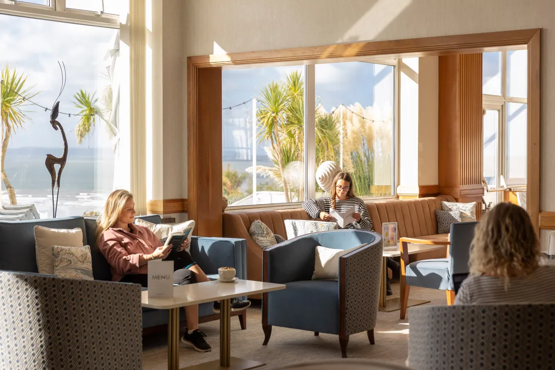 People relaxing at the Saunton Sands Hotel terrace bar in the daylight